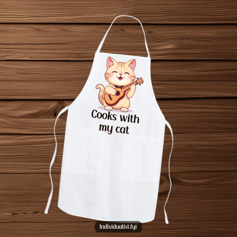 Funny cat apron showing a happy cat artistically playing a tiny, odd instrument while cooking, bringing joy to the kitchen.