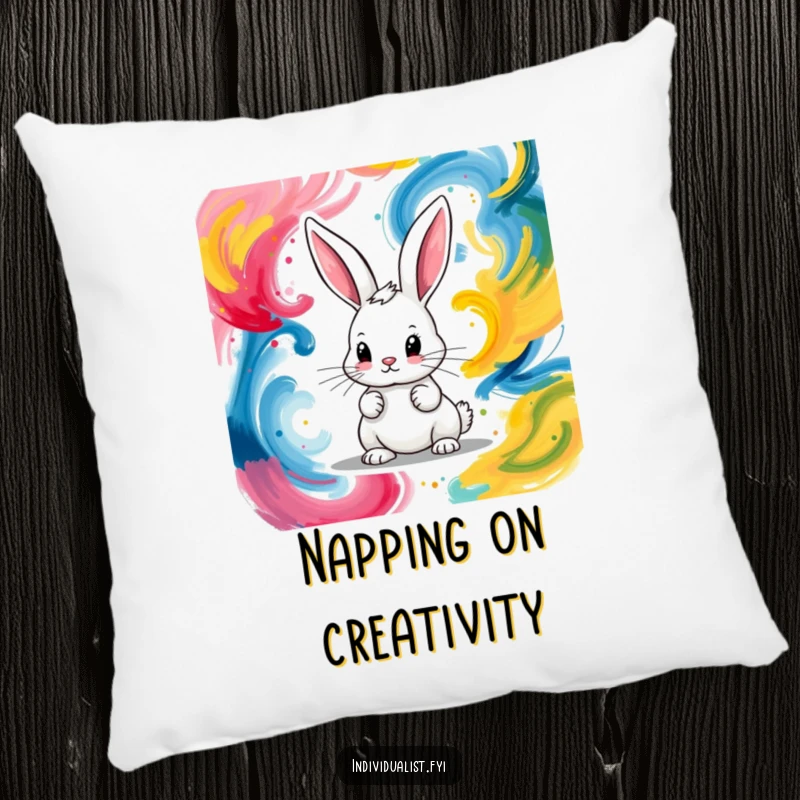 Funny pillow featuring a determined bunny artistically painting vibrant, abstract colorful swirls with passion.