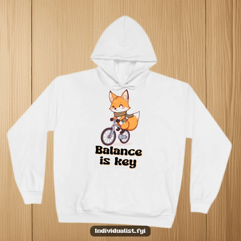 Funny Hoodie featuring a charming fox with a bright scarf confidently riding a unicycle, perfect for staying warm while embracing quirky adventures.