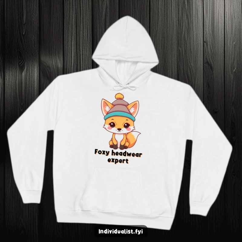 Funny hoodie depicting a curious fox wearing a vibrant, uniquely designed hat, radiating playful charm.