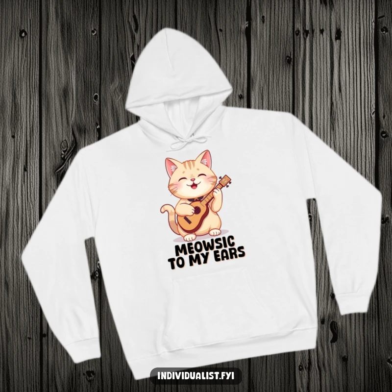Funny cat hoodie depicting a cheerful cat deeply engrossed in playing a tiny, odd-shaped musical instrument with a look of pure bliss.