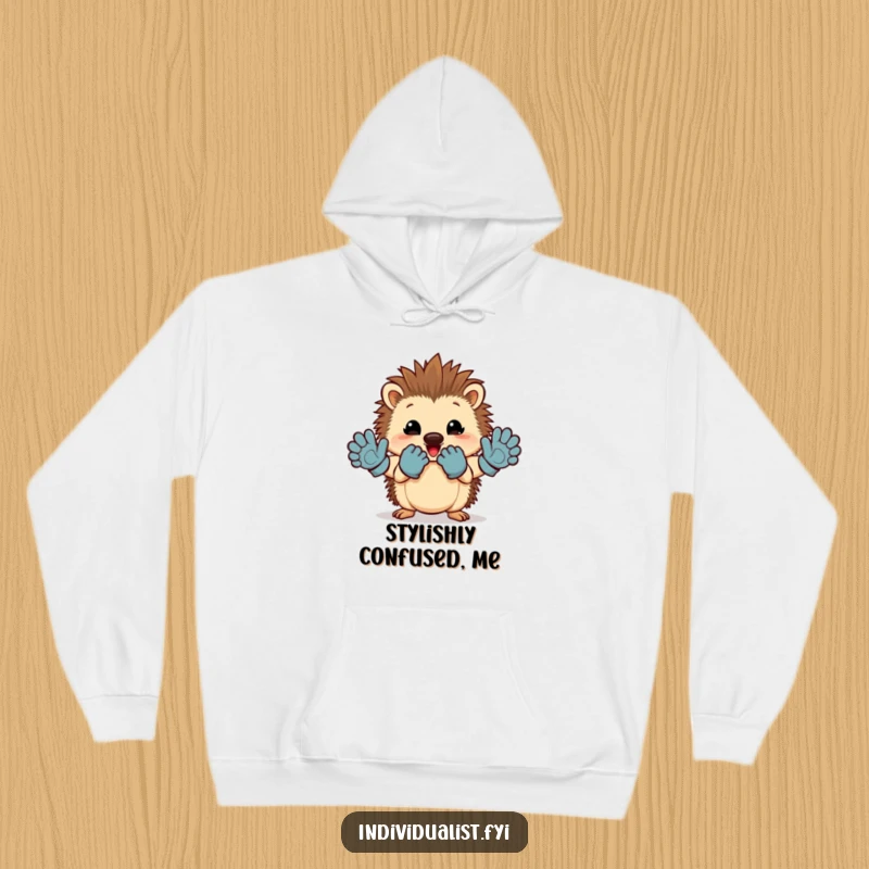 Funny hedgehog hoodie with a cheerful character proudly showing off a mismatched pair of gloves.