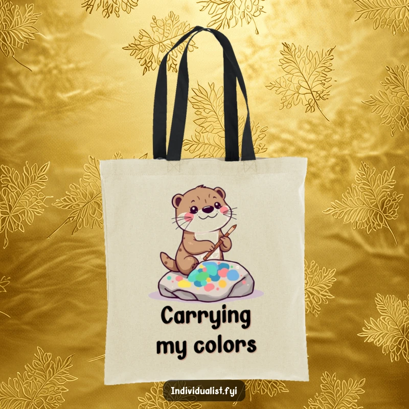 Funny kawaii otter tote bag, featuring a playful otter painting a vibrant, abstract pattern on a rock surface.