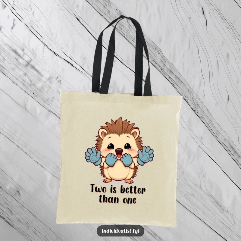 Funny hedgehog tote bag with a cheerful character proudly displaying mismatched gloves, great for shopping.